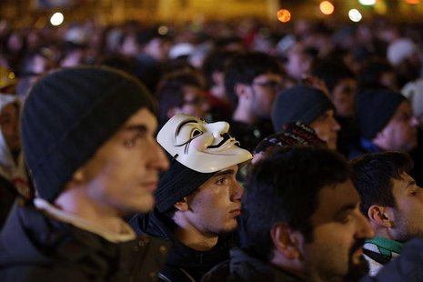 A man with a Guy Fawkes mask is seen amongst a crowd at a rally led by Five Star Movement leader and comedian Beppe Grillo in Rome February A man with a Guy Fawkes mask is seen amongst a crowd at a rally led by Five Star Movement leader and comedian Beppe Grillo in Rome February