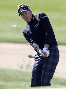 Ian Poulter of England watches his chip shot on the 4th hole during the third round of the WGC-Accenture Match Play Championship golf tourna Ian Poulter of England watches his chip shot on the 4th hole during the third round of the WGC-Accenture Match Play Championship golf tourna