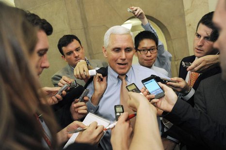 U.S. Representative Mike Pence (R-IN) (C) talks with reporters as he departs a meeting about debt ceiling legislation with fellow Republican U.S. Representative Mike Pence (R-IN) (C) talks with reporters as he departs a meeting about debt ceiling legislation with fellow Republican