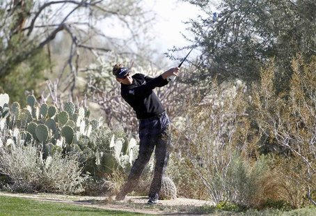 Ian Poulter of England watches his approach shot on the 11th hole during the quarterfinal round of the WGC-Accenture Match Play Championship Ian Poulter of England watches his approach shot on the 11th hole during the quarterfinal round of the WGC-Accenture Match Play Championship