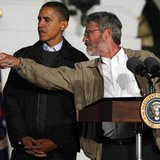 President Barack Obama (L) gets direction from White House science adviser John Holdren during an event to look at the stars with local midd President Barack Obama (L) gets direction from White House science adviser John Holdren during an event to look at the stars with local midd