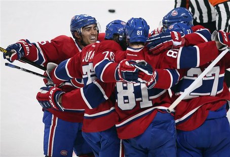Montreal Canadiens Lars Eller (81) celebrates his goal over the New York Rangers goalie Martin Biron (not pictured) with teammates Francis B Montreal Canadiens Lars Eller (81) celebrates his goal over the New York Rangers goalie Martin Biron (not pictured) with teammates Francis B