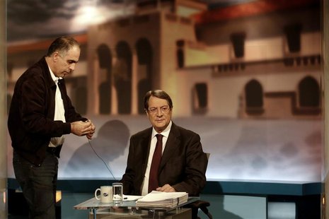 Cyprus presidential candidate Nicos Anastasiades of the right wing Democratic Rally party (R) waits for a televised debate to start in Nicos Cyprus presidential candidate Nicos Anastasiades of the right wing Democratic Rally party (R) waits for a televised debate to start in Nicos
