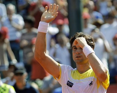 Spain's David Ferrer waves to spectators after defeating Switzerland's Stanislas Wawrinka in the Buenos Aires Open men's single tennis match Spain's David Ferrer waves to spectators after defeating Switzerland's Stanislas Wawrinka in the Buenos Aires Open men's single tennis match