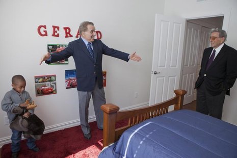 Barnes & Noble Chairman Leonard Riggio (C) and musician Tony Bennett (R) join Gerard Dugue in his room as they tour his family's new home in Barnes & Noble Chairman Leonard Riggio (C) and musician Tony Bennett (R) join Gerard Dugue in his room as they tour his family's new home in