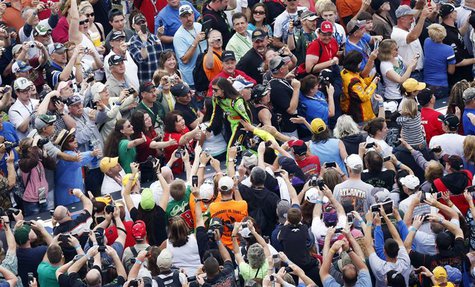 NASCAR driver Danica Patrick greets fans before the start of the NASCAR Sprint Cup Series Daytona 500 race at the Daytona International Spee NASCAR driver Danica Patrick greets fans before the start of the NASCAR Sprint Cup Series Daytona 500 race at the Daytona International Spee