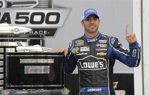 Jimmie Johnson poses next to the trophy after he won the NASCAR Sprint Cup Series Daytona 500 race at the Daytona International Speedway in Jimmie Johnson poses next to the trophy after he won the NASCAR Sprint Cup Series Daytona 500 race at the Daytona International Speedway in