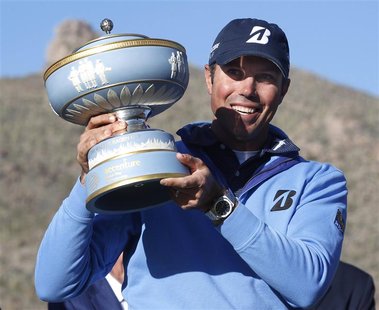 Matt Kuchar of the U.S. holds the trophy after beating Hunter Mahan 2&1 during the championship match of the WGC-Accenture Match Play Champi Matt Kuchar of the U.S. holds the trophy after beating Hunter Mahan 2&1 during the championship match of the WGC-Accenture Match Play Champi