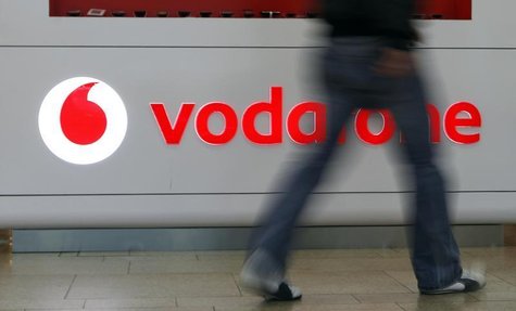 A customer walks past the Vodafone logo in a shopping mall in Prague February 7, 2012. REUTERS/David W Cerny A customer walks past the Vodafone logo in a shopping mall in Prague February 7, 2012. REUTERS/David W Cerny