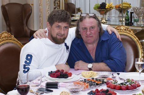 Actor Gerard Depardieu (R) poses for a picture with Chechen President Ramzan Kadyrov during a meeting at the presidential residence as he vi Actor Gerard Depardieu (R) poses for a picture with Chechen President Ramzan Kadyrov during a meeting at the presidential residence as he vi