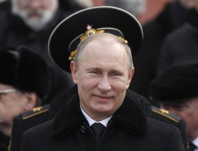 Russian President Vladimir Putin attends a wreath laying ceremony to mark the Defender of the Fatherland Day in Moscow February 23, 2013. RE Russian President Vladimir Putin attends a wreath laying ceremony to mark the Defender of the Fatherland Day in Moscow February 23, 2013. RE