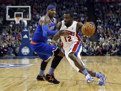 Detroit Pistons point guard Will Bynum (12) drives the ball past New York Knicks small forward Carmelo Anthony (7) during their regulation N Detroit Pistons point guard Will Bynum (12) drives the ball past New York Knicks small forward Carmelo Anthony (7) during their regulation N