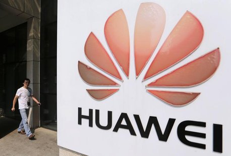 A man walks past a Huawei company logo outside the entrance of a Huawei office in Wuhan, Hubei province October 9, 2012. REUTERS/Stringer A man walks past a Huawei company logo outside the entrance of a Huawei office in Wuhan, Hubei province October 9, 2012. REUTERS/Stringer