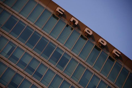 A logo of China National Offshore Oil Corp (CNOOC) is seen at the top of its headquarters in Beijing November 14, 2012. REUTERS/Petar Kujund A logo of China National Offshore Oil Corp (CNOOC) is seen at the top of its headquarters in Beijing November 14, 2012. REUTERS/Petar Kujund