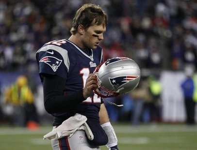 New England Patriots quarterback Tom Brady walks off the field after throwing an interception against the the Baltimore Ravens in the final New England Patriots quarterback Tom Brady walks off the field after throwing an interception against the the Baltimore Ravens in the final