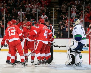 A FREQUENT SIGHT: Detroit Red Wings players celebrate in front of Vancouver goaltender Roberto Luongo (R) after one of their eight goals in an 8-3 triumph over the Canucks on Feb. 24, 2013. (Photo courtesy Detroit Red Wings) A FREQUENT SIGHT: Detroit Red Wings players celebrate in front of Vancouver goaltender Roberto Luongo (R) after one of their eight goals in an 8-3 triumph over the Canucks on Feb. 24, 2013. (Photo courtesy Detroit Red Wings)