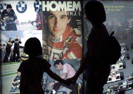Visitors look at pictures of Brazilian Formula One driver Ayrton Senna displayed at the "Ayrton Senna Trajectory" exhibition in Sao Paulo, M Visitors look at pictures of Brazilian Formula One driver Ayrton Senna displayed at the "Ayrton Senna Trajectory" exhibition in Sao Paulo, M