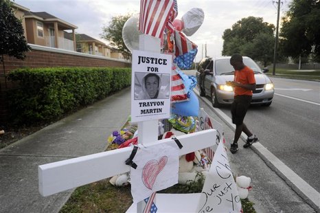 Jaquez Forest, 12, of Sanford, Florida, photographs a memorial for Trayvon Martin in Sanford, Florida, in this March 29, 2012 file photo. A Jaquez Forest, 12, of Sanford, Florida, photographs a memorial for Trayvon Martin in Sanford, Florida, in this March 29, 2012 file photo. A