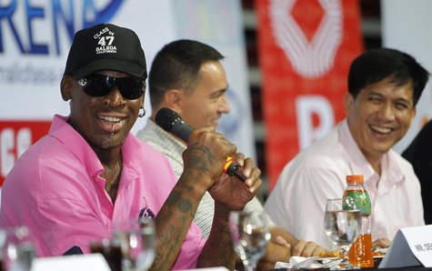 Former NBA Chicago Bulls player Dennis Rodman (L) shares a light moment during a news conference inside a mall of Asia Arena in Manila July Former NBA Chicago Bulls player Dennis Rodman (L) shares a light moment during a news conference inside a mall of Asia Arena in Manila July