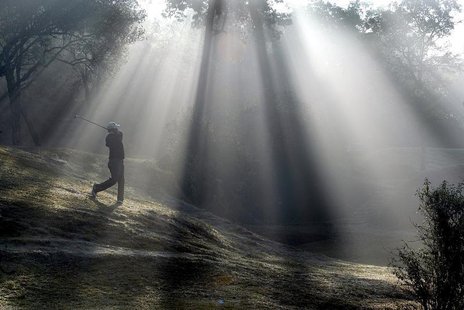 A Nepali golfer hits a shot at the Royal Nepal Golf Course in Kathmandu February 24, 2005. REUTERS/Gopal Chitrakar A Nepali golfer hits a shot at the Royal Nepal Golf Course in Kathmandu February 24, 2005. REUTERS/Gopal Chitrakar
