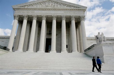U.S. Supreme Court Justice Elena Kagan walks back into the Supreme Court building with Chief Justice of the United States John Roberts after U.S. Supreme Court Justice Elena Kagan walks back into the Supreme Court building with Chief Justice of the United States John Roberts after
