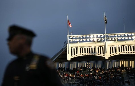 A New York City Police Officer stands guard at Yankee stadium in New York, in this file photo taken October 12, 2012. REUTERS/Mike Segar A New York City Police Officer stands guard at Yankee stadium in New York, in this file photo taken October 12, 2012. REUTERS/Mike Segar