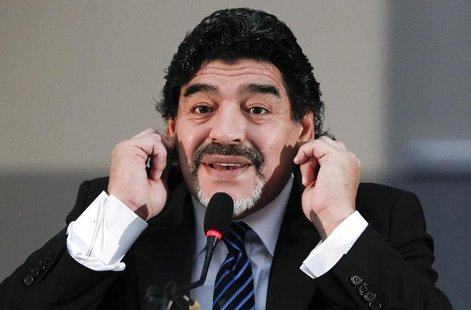 Former Argentine soccer star Diego Maradona gestures during a news conference in Naples February 26, 2013. REUTERS/Ciro De Luca Former Argentine soccer star Diego Maradona gestures during a news conference in Naples February 26, 2013. REUTERS/Ciro De Luca