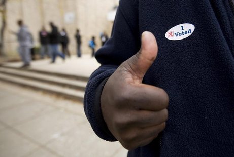 A voter gives a thumb's up after voting at the Martin Luther King Jr. Elementary School in the Anacostia neighborhood of Washington, in this A voter gives a thumb's up after voting at the Martin Luther King Jr. Elementary School in the Anacostia neighborhood of Washington, in this