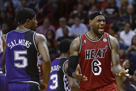 Sacramento Kings' John Salmons (L) watches Miami Heat's LeBron James (R) react to a call by an official during the first half of their NBA b Sacramento Kings' John Salmons (L) watches Miami Heat's LeBron James (R) react to a call by an official during the first half of their NBA b