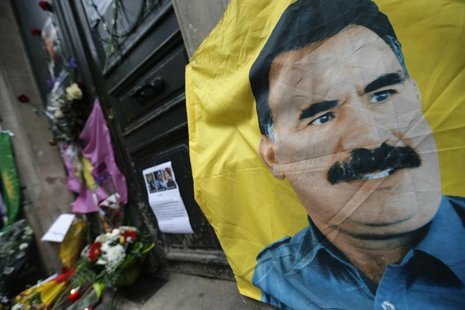 A flag with the portrait of jailed Kurdistan Workers Party (PKK) leader Abdullah Ocalan is seen in front of the entrance of the Information A flag with the portrait of jailed Kurdistan Workers Party (PKK) leader Abdullah Ocalan is seen in front of the entrance of the Information