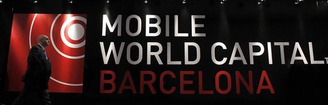 A visitor walks past a Mobile World banner at the Mobile World Congress in Barcelona, February 26, 2013. The GSMA Mobile World Congress, rep A visitor walks past a Mobile World banner at the Mobile World Congress in Barcelona, February 26, 2013. The GSMA Mobile World Congress, rep