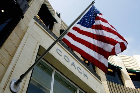 An American flag flies at a Coach Inc. full-price store in Los Angeles, California July 29, 2008. REUTERS/Fred Prouser An American flag flies at a Coach Inc. full-price store in Los Angeles, California July 29, 2008. REUTERS/Fred Prouser