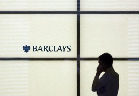 A man gestures whilst speaking on a mobile telephone at Barclays Bank in the financial district of Canary Wharf in London January 19, 2009. A man gestures whilst speaking on a mobile telephone at Barclays Bank in the financial district of Canary Wharf in London January 19, 2009.