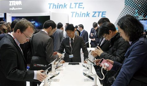 Visitors look at devices at ZTE booth at the Mobile World Congress in Barcelona, February 26, 2013. REUTERS/Albert Gea Visitors look at devices at ZTE booth at the Mobile World Congress in Barcelona, February 26, 2013. REUTERS/Albert Gea
