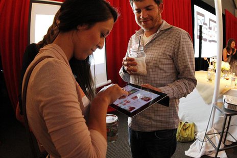 People interact with a Pinterest app on a tablet device during a launch party, August 14, 2012. REUTERS/Pinterest/Handout People interact with a Pinterest app on a tablet device during a launch party, August 14, 2012. REUTERS/Pinterest/Handout