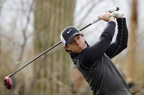 Northern Ireland's Rory McIlroy hits off the 8th tee against Shane Lowry of Ireland during the weather delayed first round of the WGC-Accent Northern Ireland's Rory McIlroy hits off the 8th tee against Shane Lowry of Ireland during the weather delayed first round of the WGC-Accent