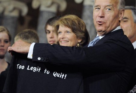 U.S. Senator Lisa Murkowski (R-AK) (C) hands Vice President Joe Biden (2nd R) one of her campaign t-shirts after the ceremonial re-enactment U.S. Senator Lisa Murkowski (R-AK) (C) hands Vice President Joe Biden (2nd R) one of her campaign t-shirts after the ceremonial re-enactment