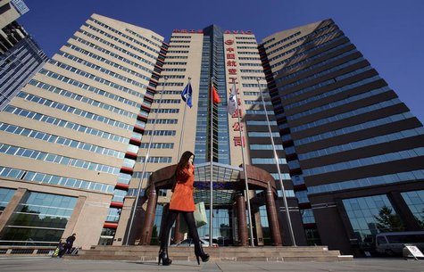 A woman walks past the Aviation Industry Corporation of China (AVIC) headquarters building in Beijing October 30, 2012. REUTERS/Jason Lee A woman walks past the Aviation Industry Corporation of China (AVIC) headquarters building in Beijing October 30, 2012. REUTERS/Jason Lee
