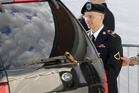 Army Private First Class Bradley Manning is escorted in handcuffs as he leaves the courthouse in Fort Meade, Maryland June 6, 2012. REUTERS/ Army Private First Class Bradley Manning is escorted in handcuffs as he leaves the courthouse in Fort Meade, Maryland June 6, 2012. REUTERS/