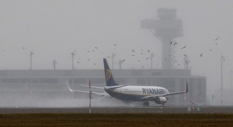 A Ryanair aircraft starts in front of the construction site of the future Berlin Brandenburg international airport Willy Brandt (BER) in Sch A Ryanair aircraft starts in front of the construction site of the future Berlin Brandenburg international airport Willy Brandt (BER) in Sch