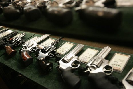 Guns are seen inside a display case at the Cabela's store in Fort Worth, Texas, June 26, 2008. REUTERS/Jessica Rinaldi Guns are seen inside a display case at the Cabela's store in Fort Worth, Texas, June 26, 2008. REUTERS/Jessica Rinaldi