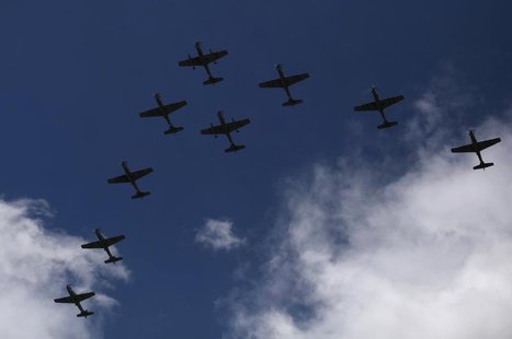 Super Tucano combat planes fly during a ceremony to mark the 93rd anniversary of the Colombian Air Force at the military base in Bogota Nove Super Tucano combat planes fly during a ceremony to mark the 93rd anniversary of the Colombian Air Force at the military base in Bogota Nove