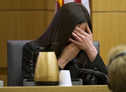 Jodi Arias breaks down after being asked by prosecutor Juan Martinez if she was crying when she stabbed Travis Alexander and when she slit h Jodi Arias breaks down after being asked by prosecutor Juan Martinez if she was crying when she stabbed Travis Alexander and when she slit h