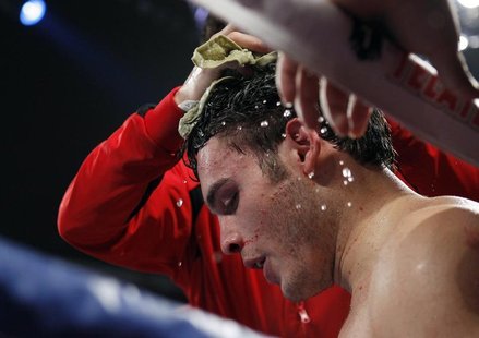 Julio Cesar Chavez Jr. of Mexico is treated in his corner between rounds during his bout against Sergio Martinez of Argentina at the Thomas Julio Cesar Chavez Jr. of Mexico is treated in his corner between rounds during his bout against Sergio Martinez of Argentina at the Thomas
