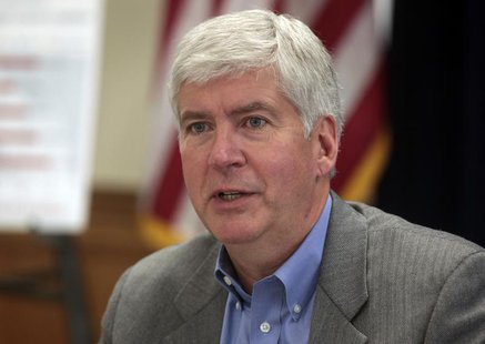 Michigan Governor Rick Snyder talks about the future of the city of Detroit during a news conference in Detroit, Michigan February 21, 2013. Michigan Governor Rick Snyder talks about the future of the city of Detroit during a news conference in Detroit, Michigan February 21, 2013.