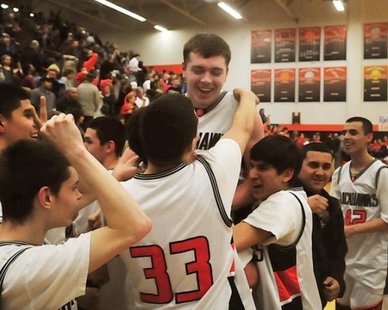 Teammates lift Fennville junior forward Wes Leonard following his game-winning shot in a 57-55 overtime win over visiting Bridgman on Mar. 3, 2011. Teammates lift Fennville junior forward Wes Leonard following his game-winning shot in a 57-55 overtime win over visiting Bridgman on Mar. 3, 2011.