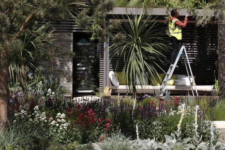 A worker prepares the Cancer Research UK Garden ahead of the opening of the Chelsea Flower Show 2011 on Tuesday, in London in this file phot A worker prepares the Cancer Research UK Garden ahead of the opening of the Chelsea Flower Show 2011 on Tuesday, in London in this file phot