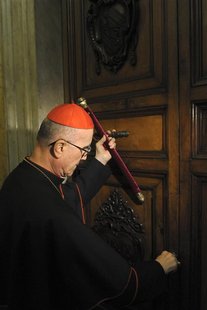 Cardinal Tarcisio Bertone seals the door of the apartment of Pope Benedict XVI at the Vatican February 28, 2013. REUTERS/Osservatore Romano Cardinal Tarcisio Bertone seals the door of the apartment of Pope Benedict XVI at the Vatican February 28, 2013. REUTERS/Osservatore Romano