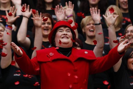 Singer Susan Boyle smiles as poppy's fall over her at a photocall during the launch of the Poppy Scotland appeal in Glasgow, Scotland in thi Singer Susan Boyle smiles as poppy's fall over her at a photocall during the launch of the Poppy Scotland appeal in Glasgow, Scotland in thi