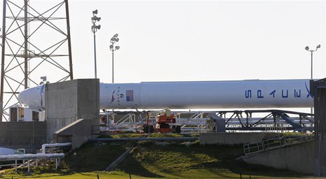 The SpaceX Falcon 9 rocket with the Dragon capsule rests near its launching pad as it is prepared for launch at the Cape Canveral Air Force The SpaceX Falcon 9 rocket with the Dragon capsule rests near its launching pad as it is prepared for launch at the Cape Canveral Air Force